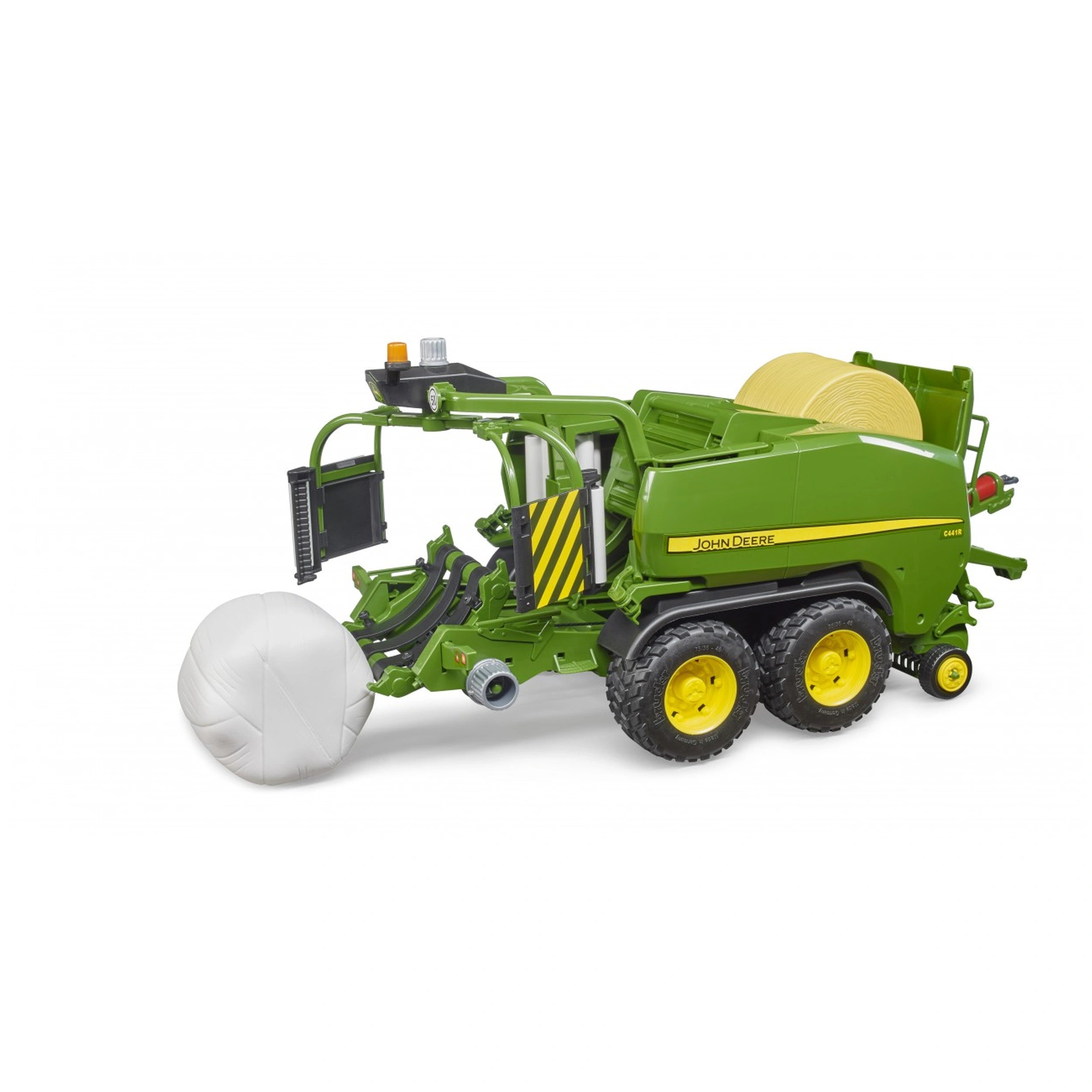 Green John Deere C441R toy baler with yellow accents, producing a white bale, showcasing realistic farming details.