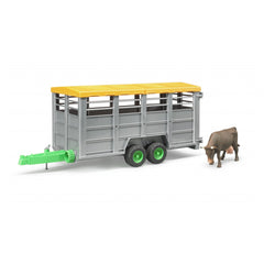 Gray livestock trailer with yellow roof and green hitch, includes a brown cow figure, designed for farm-themed play.