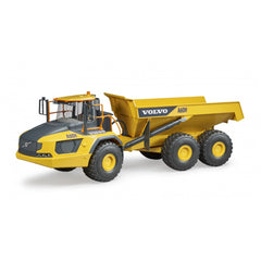 Yellow and gray Bruder Volvo Hauler A60H toy with articulated steering and large tires, side view.