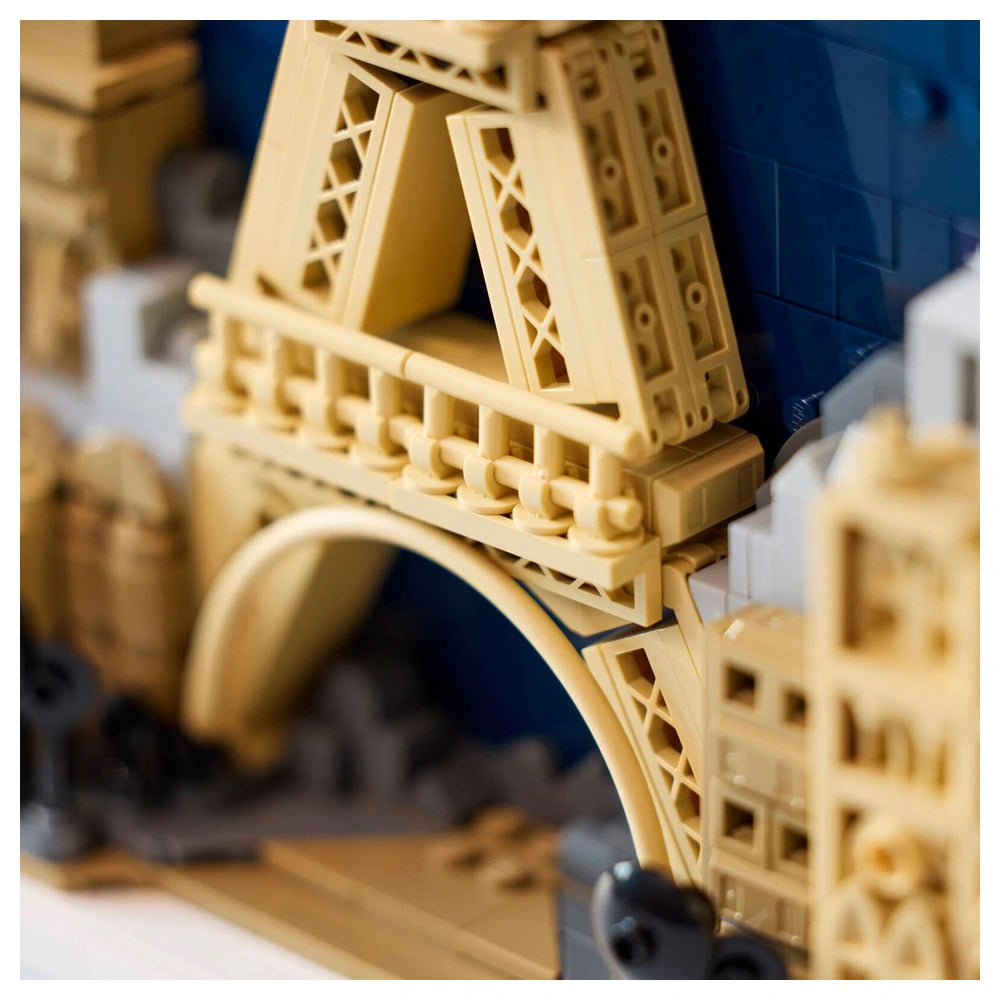 LEGO Architecture Paris set features a detailed beige and tan model of a bridge or archway with interlocked bricks.