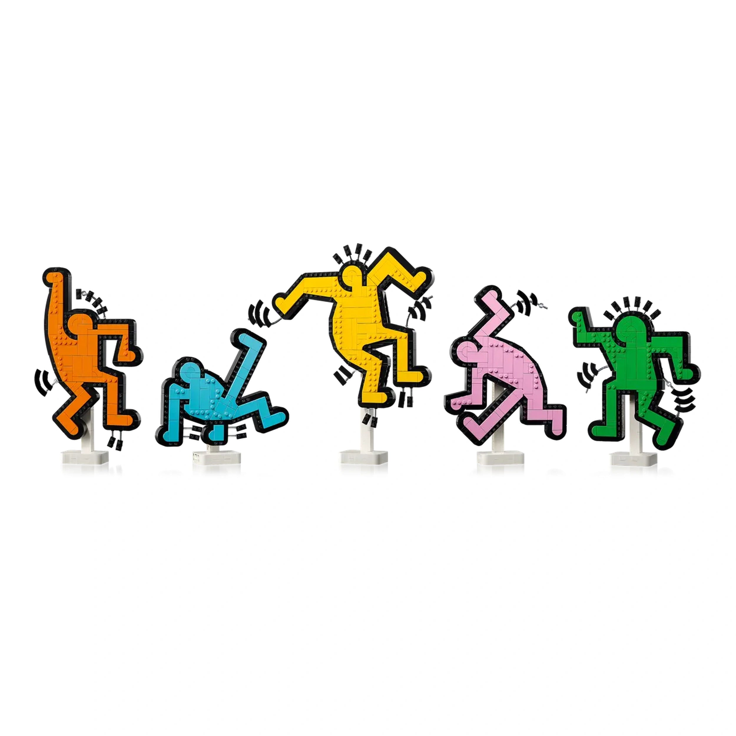 Five colorful LEGO figures inspired by Keith Haring's art, featuring vibrant orange, blue, yellow, pink, and green dancing motifs with playful poses.