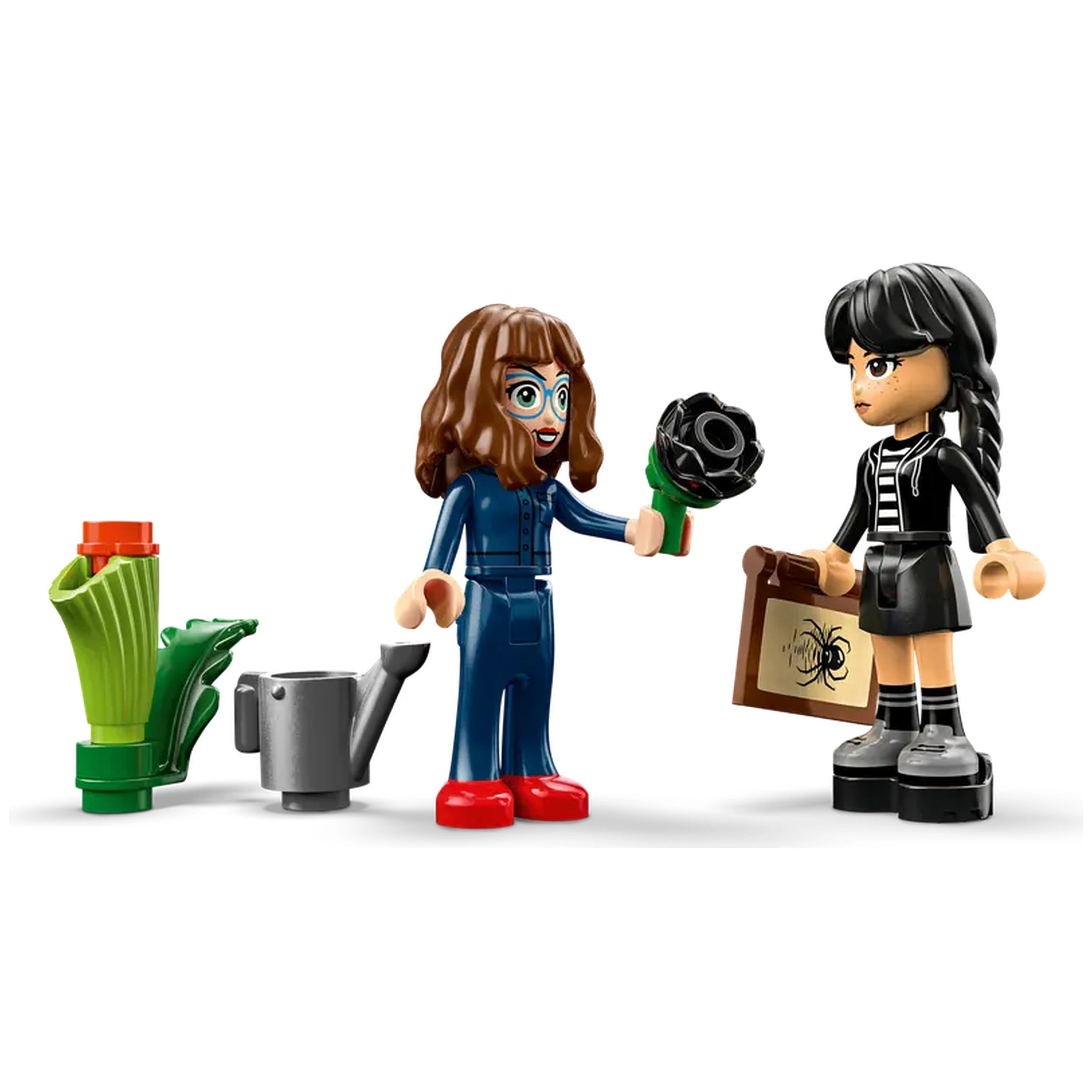 Two LEGO figures stand together, one holding a black dahlia flower and the other carrying a briefcase with a spider design. A watering can and a green plant element are visible nearby.