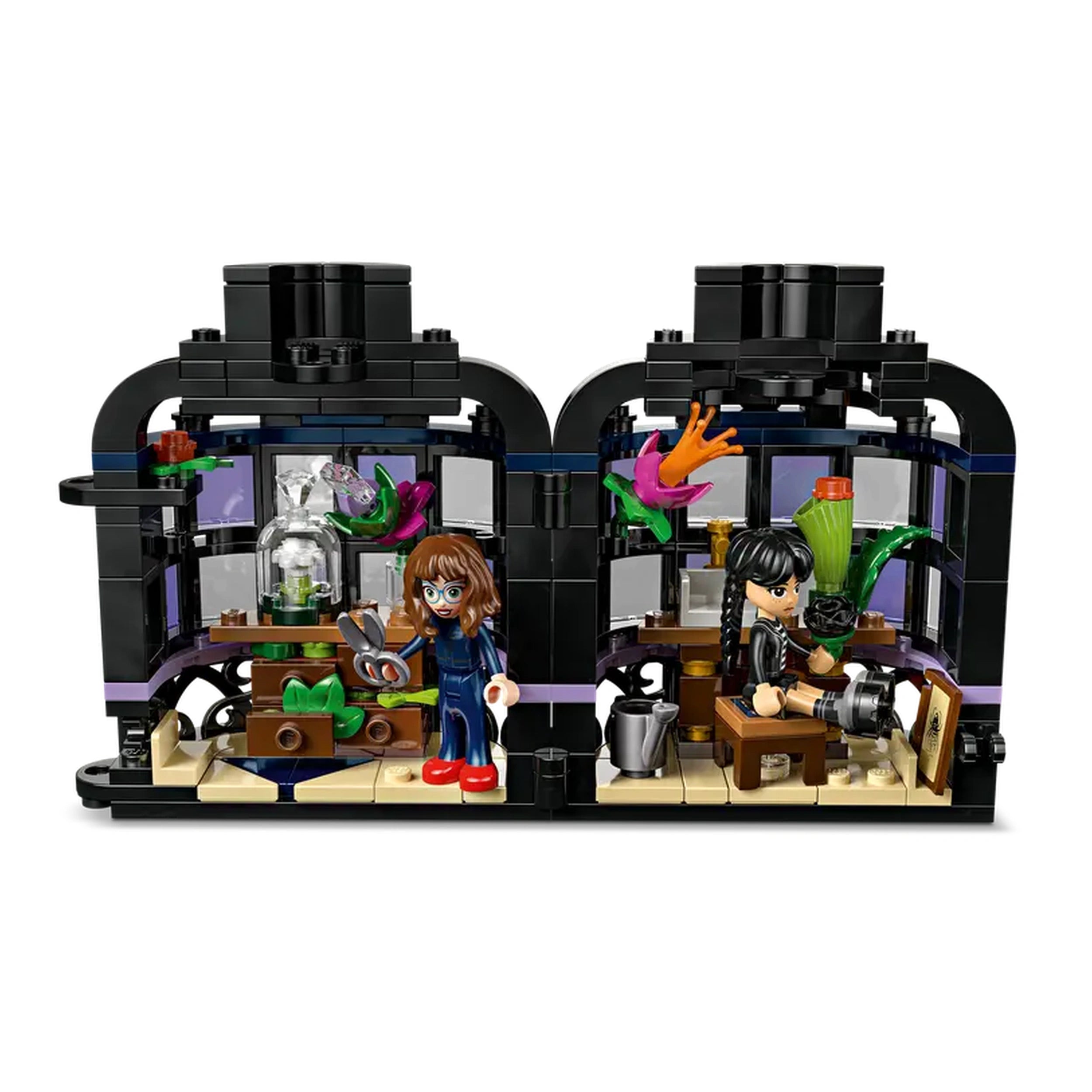 Two playful minifigures in a black conservation-style building, one holding scissors near a plant and the other seated with a camera, surrounded by vibrant flower decorations and a classroom setup with a desk.