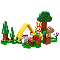 LEGO Animal Crossing Bunnie's Outdoor Activities set featuring a colorful campsite, a yellow tent, and a Bunnie minifigure with accessories.