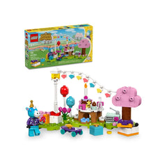 Colorful LEGO® Animal Crossing™ Julian's Birthday Party set featuring a unicorn figure, festive decorations, a birthday cake, and gifts, surrounded by flowers and trees.