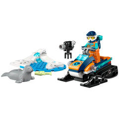 LEGO City Arctic Explorer set featuring a bright orange snowmobile, an explorer minifigure, and two seal figures on an icy terrain.