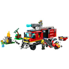 LEGO City Fire Command Truck set featuring a red fire truck with a detachable control center, two drones, and three firefighter minifigures, engaged in a firefighting scenario with flames and trees in the background.