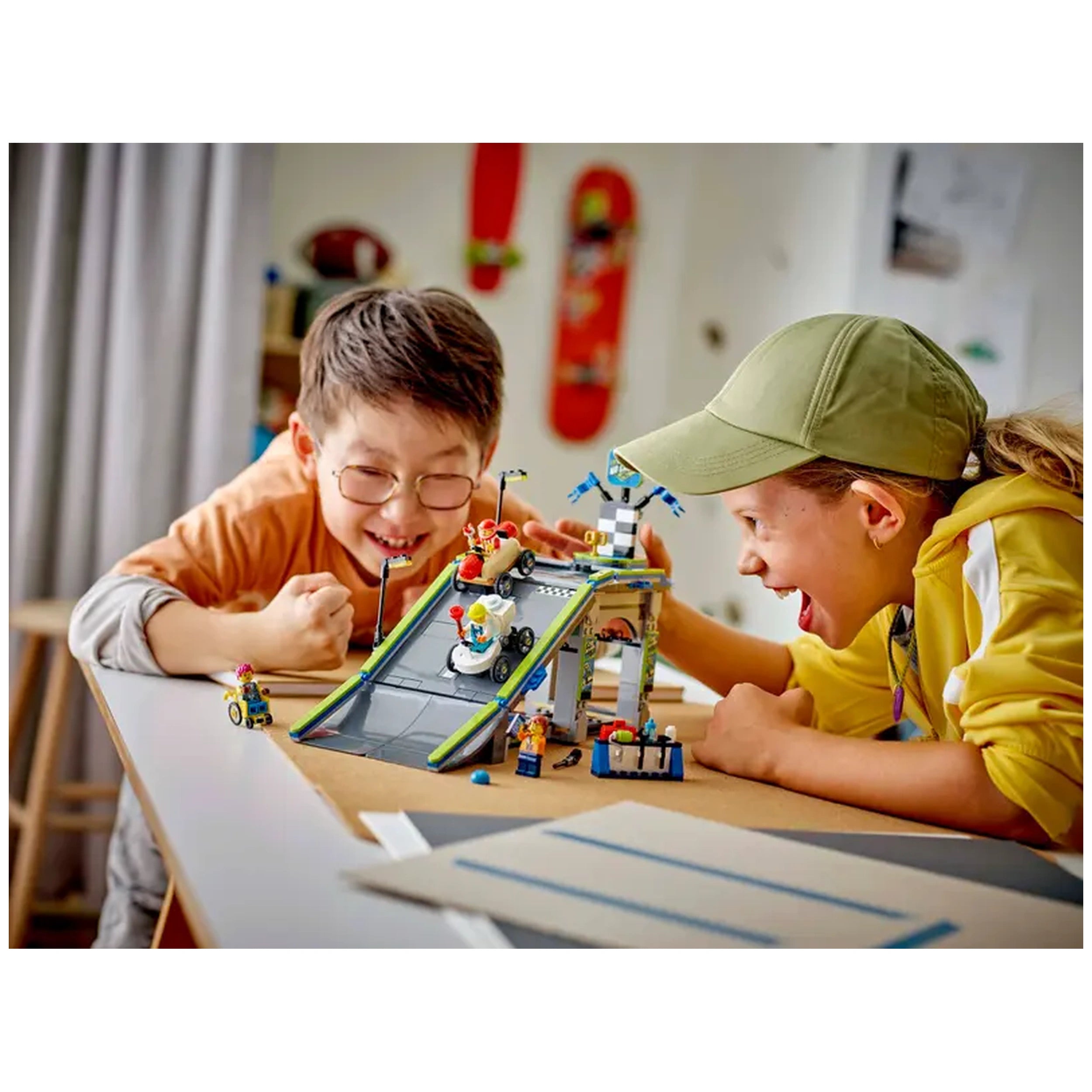Two children joyfully playing with the LEGO® City No Limits: Race Car Ramp Track set, featuring a colorful ramp and whimsical soapbox cars.