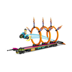 LEGO® City Stunt Truck & Ring of Fire Challenge set featuring a motorcycle rider jumping through three fiery rings on a flatbed trailer.