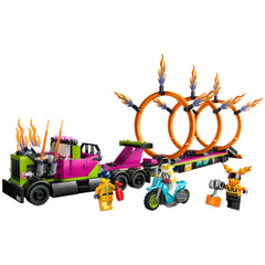LEGO® City Stunt Truck with vibrant green and purple details, featuring three fiery rings and a flywheel motorcycle, plus four minifigures ready for action.