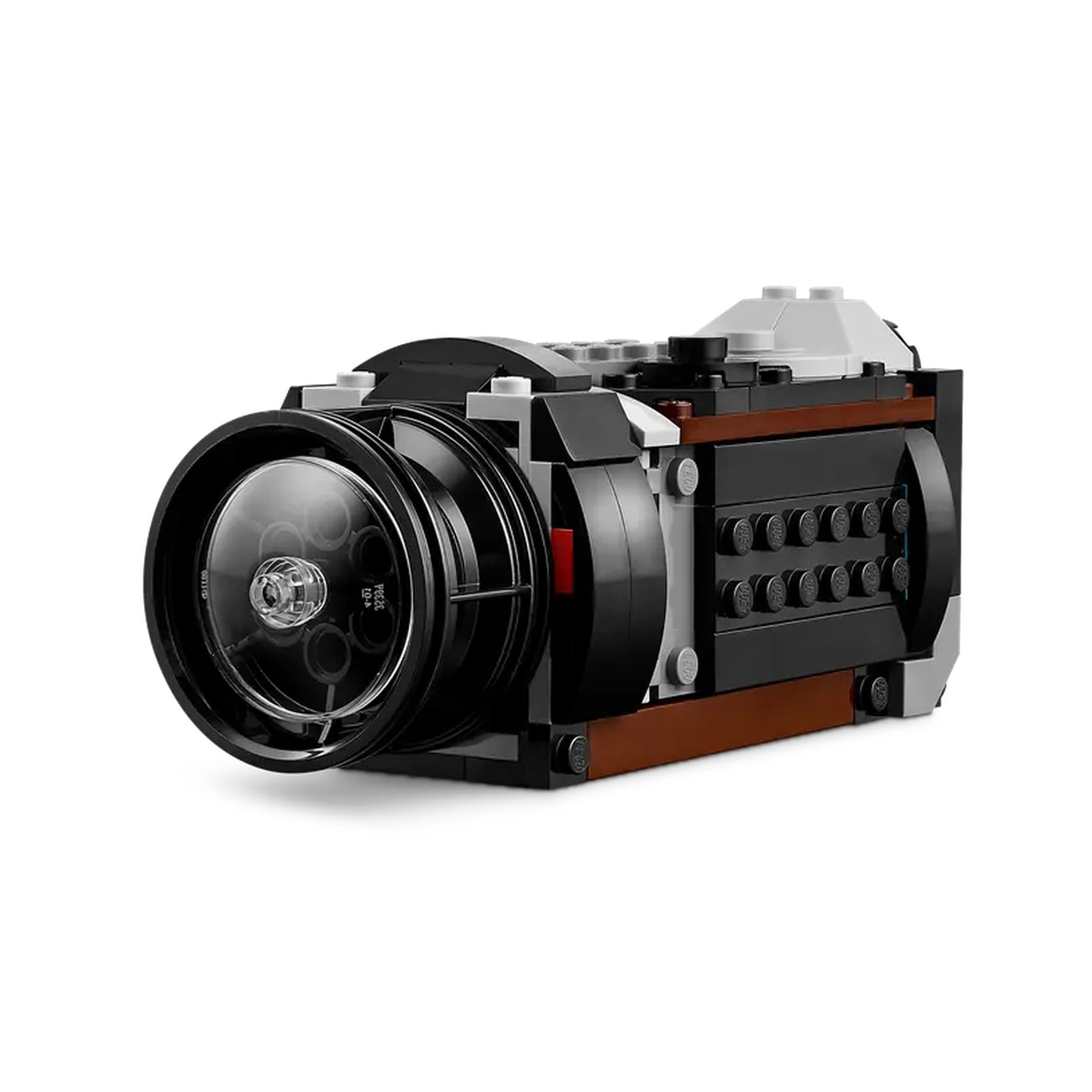 LEGO® Creator Retro Camera construction set in retro design, featuring a detailed lens, buttons, and brick-built film slot, showcasing versatile 3-in-1 play.