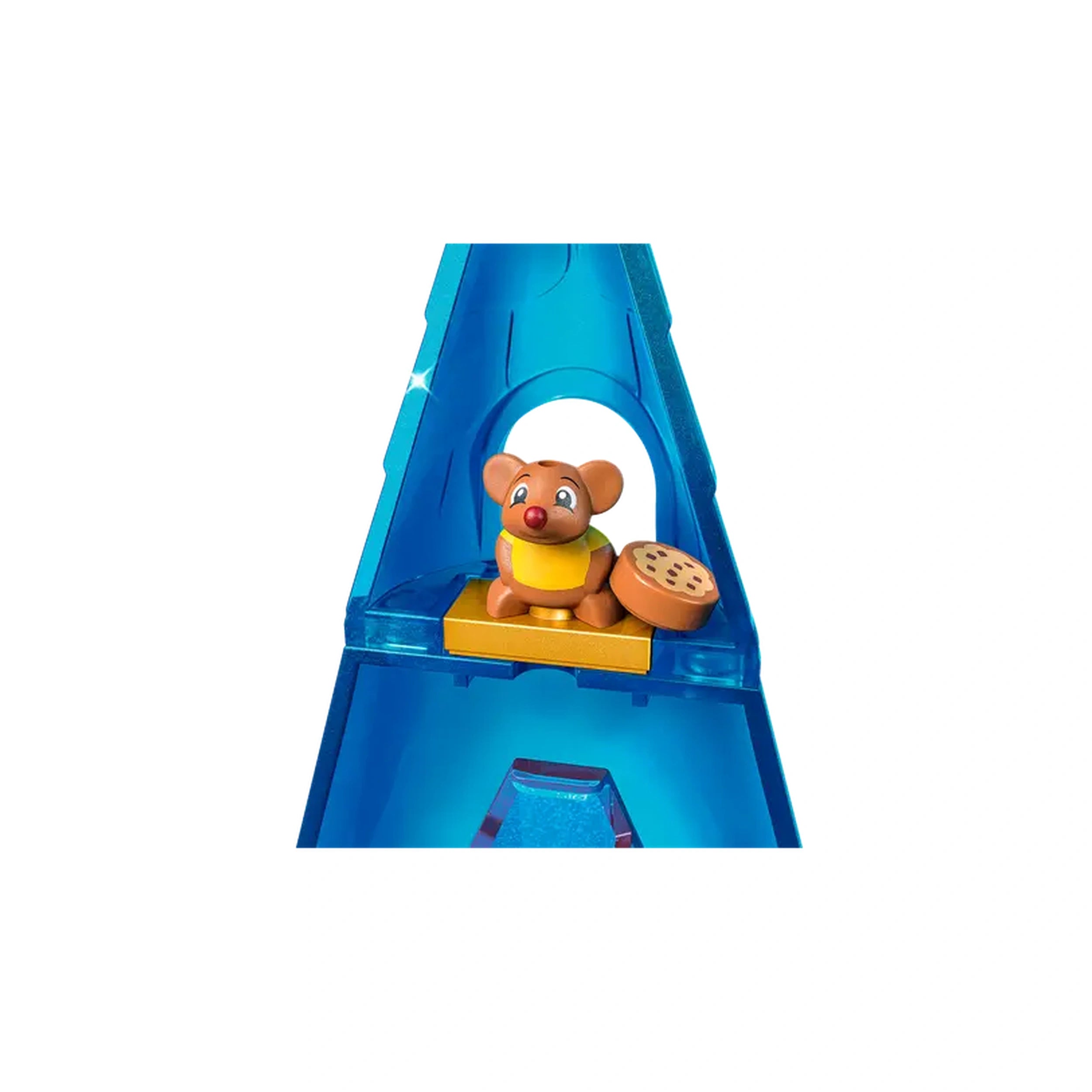 A playful LEGO® figure of a brown mouse wearing a yellow shirt, sitting on a bright blue castle structure, next to a cookie.
