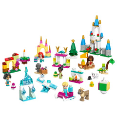 A vibrant collection of LEGO® Disney Advent Calendar pieces featuring iconic characters like Elsa, Ariel, and Moana, alongside colorful mini builds such as castles, trees, and festive decorations, arranged playfully on a white background.