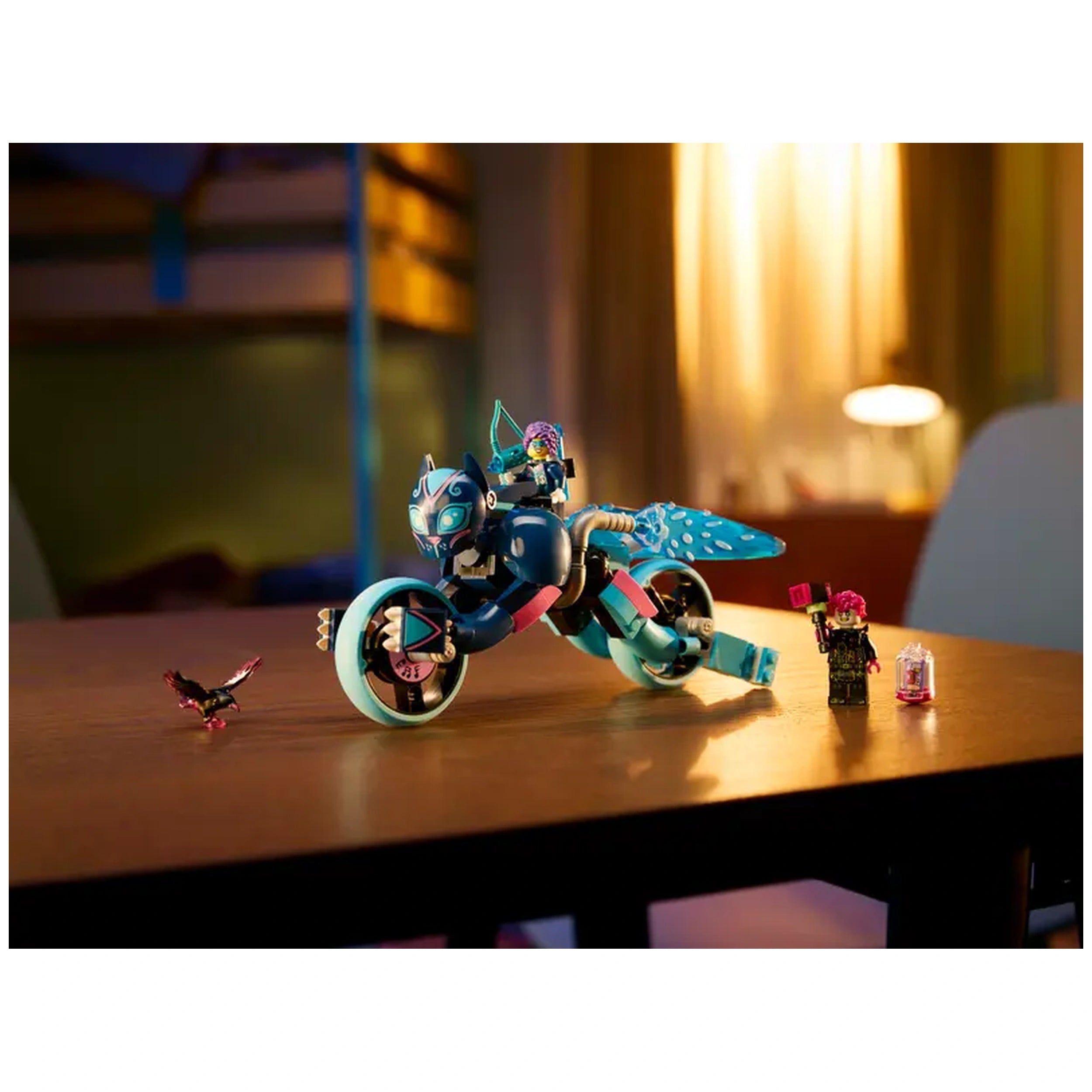 LEGO® DREAMZzz™ Zoey on a blue cat motorcycle with shining wheels, facing a small raven on a wooden table, set in a cozy room.