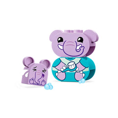 Two colorful LEGO® DUPLO® elephant figures, one larger in a blue bath outfit holding a scrub brush, and a smaller one showing an expressive face with tears and soap bubbles.