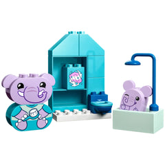LEGO® DUPLO® Bath Time construction set featuring two playful elephant figures, a vibrant blue bathroom scene with a shower, toilet, and sink.