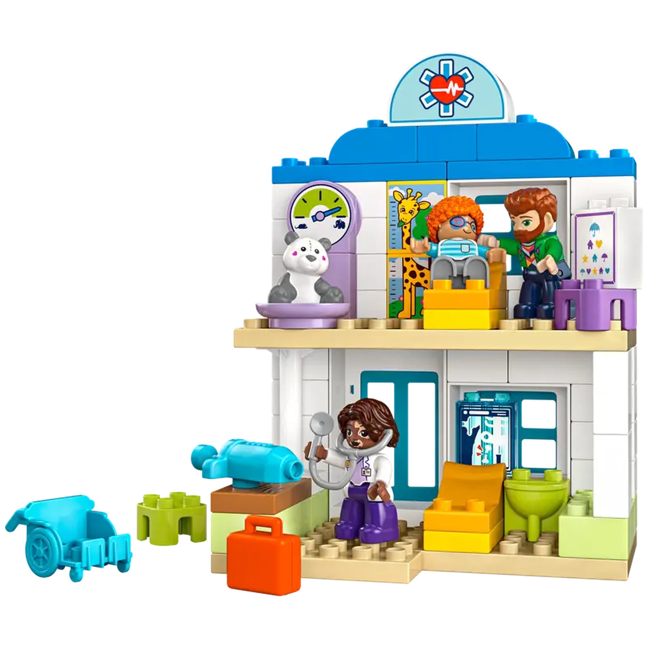 LEGO® DUPLO® Town hospital playset featuring a two-story building, a doctor figure, a child with orange hair, and a teddy bear. Props include a wheelchair, syringe, and medical equipment, all in bright colors.