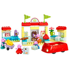 LEGO® DUPLO® Peppa Pig Supermarket construction set featuring Peppa and George with a red car, shopping cart, and colorful grocery store elements.