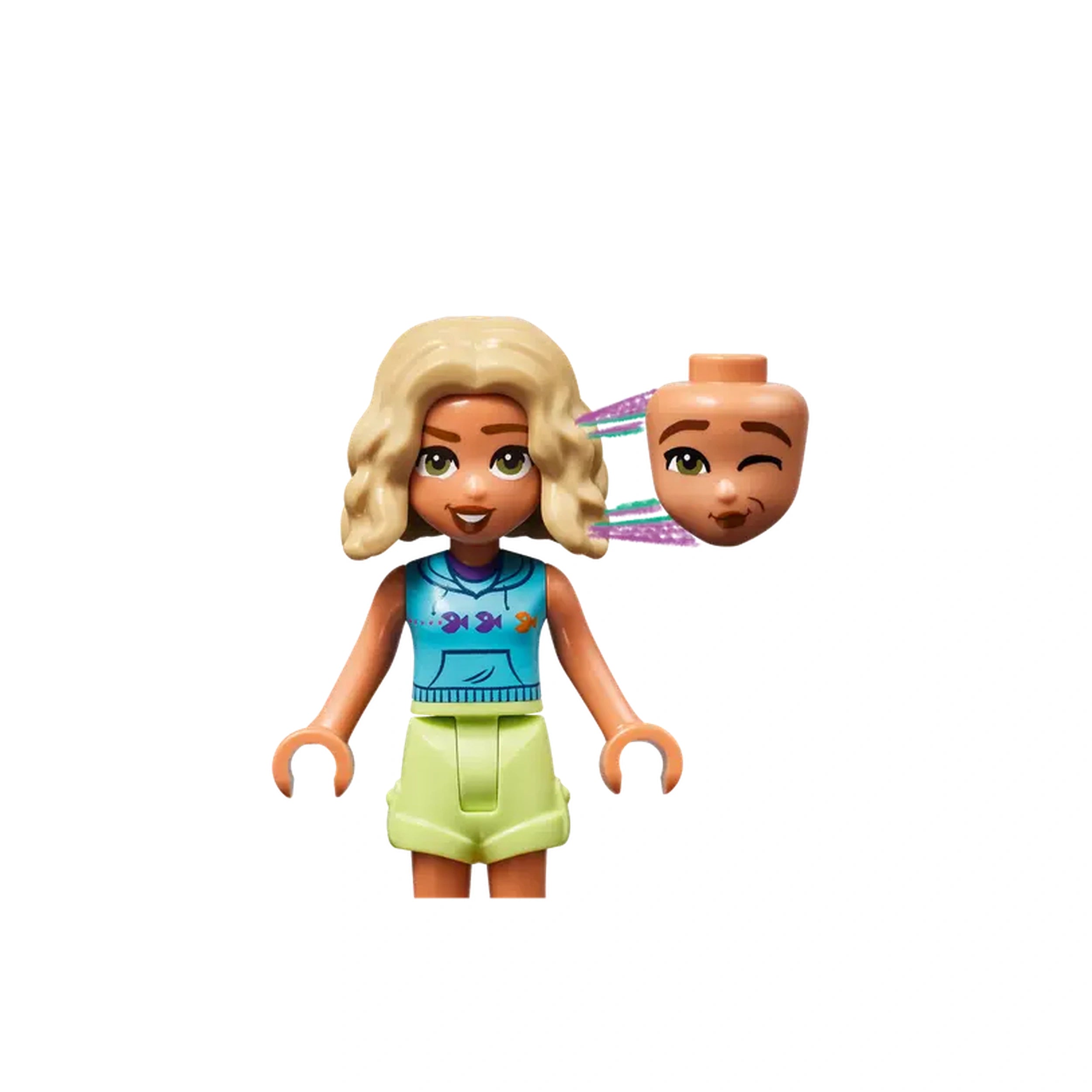 Blonde-haired LEGO® Friends mini-doll with a bright blue shirt and light green shorts, holding an interchangeable winking head.