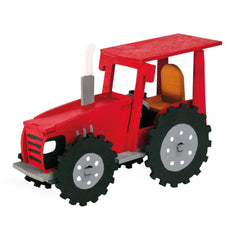 Red 3D model of a tractor made from birch plywood, featuring black wheels and a grey exhaust pipe, angled left.