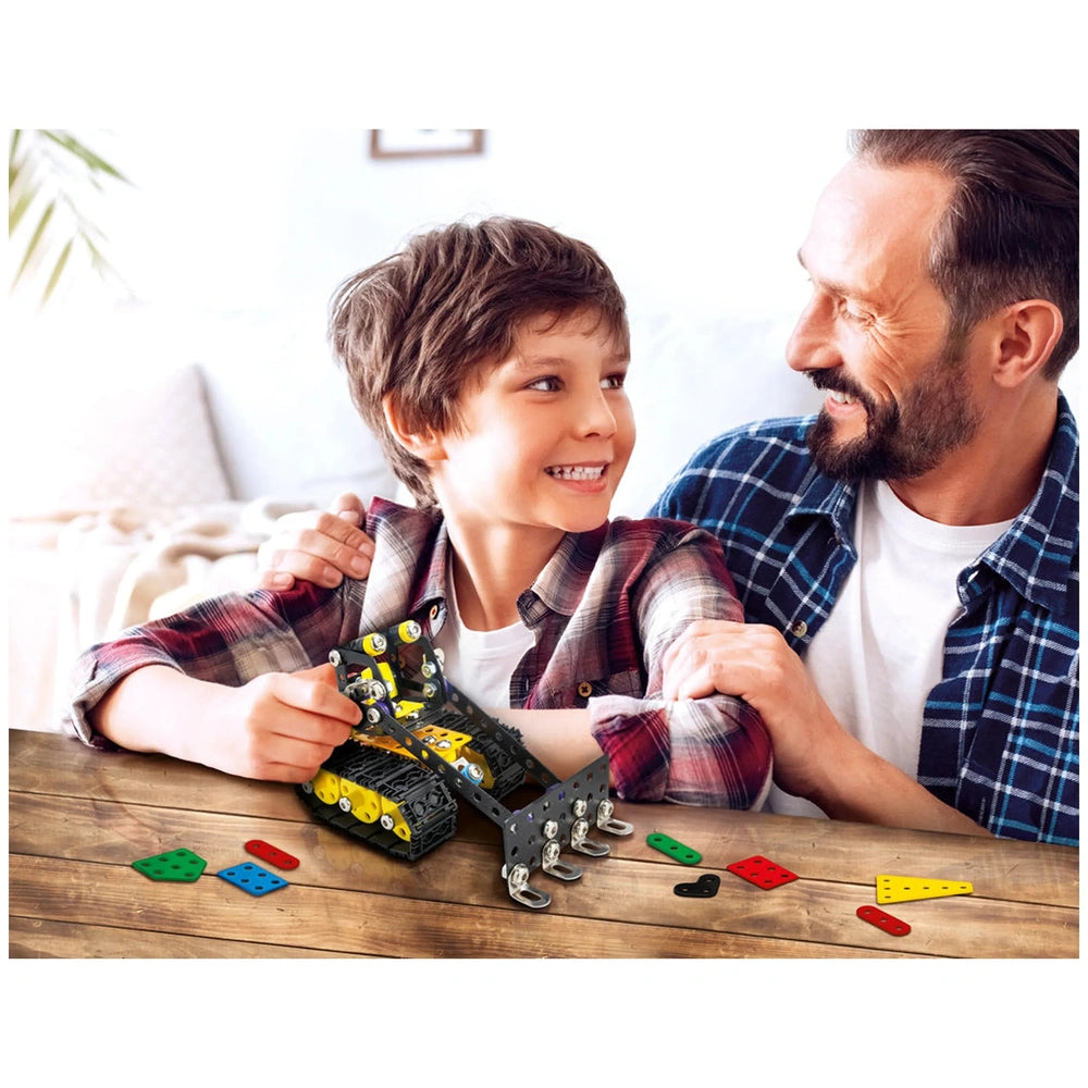 Father and son smiling while assembling the Alexander Ruspa construction set on a wooden table.