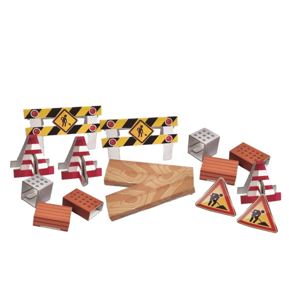 Construction play set with barriers, warning signs, and wooden planks arranged on a white background.