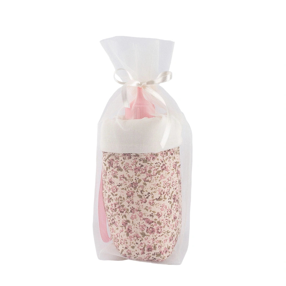 Floral-patterned bottle holder in sheer white fabric tied with a ribbon, part of the ASI Dolls Martina Collection.