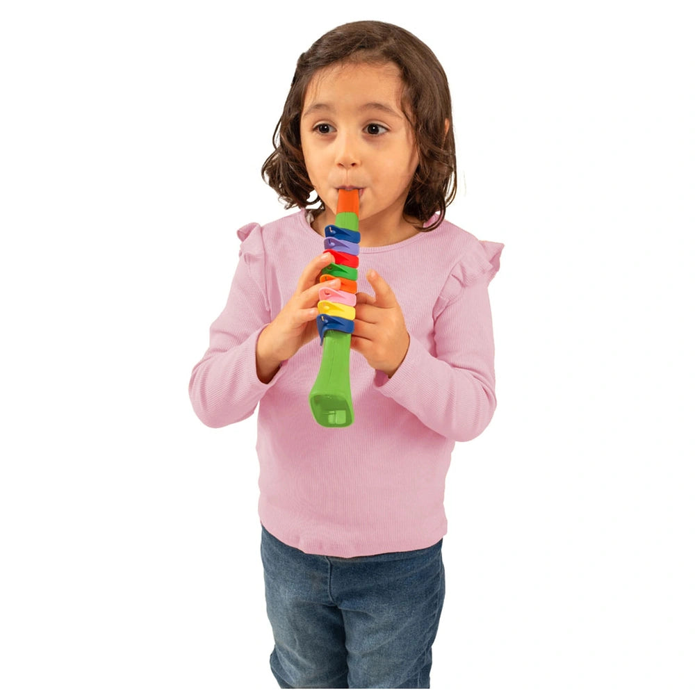 Bontempi Mini Trumpet in green held by a young girl in a pink top and blue jeans, featuring a colorful multi-section body.