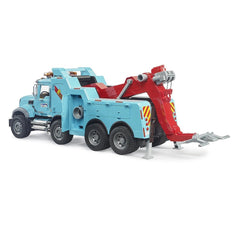 Blue and red toy recovery truck with six wheels, featuring extendable towing arm and safety decals, by Bruder.