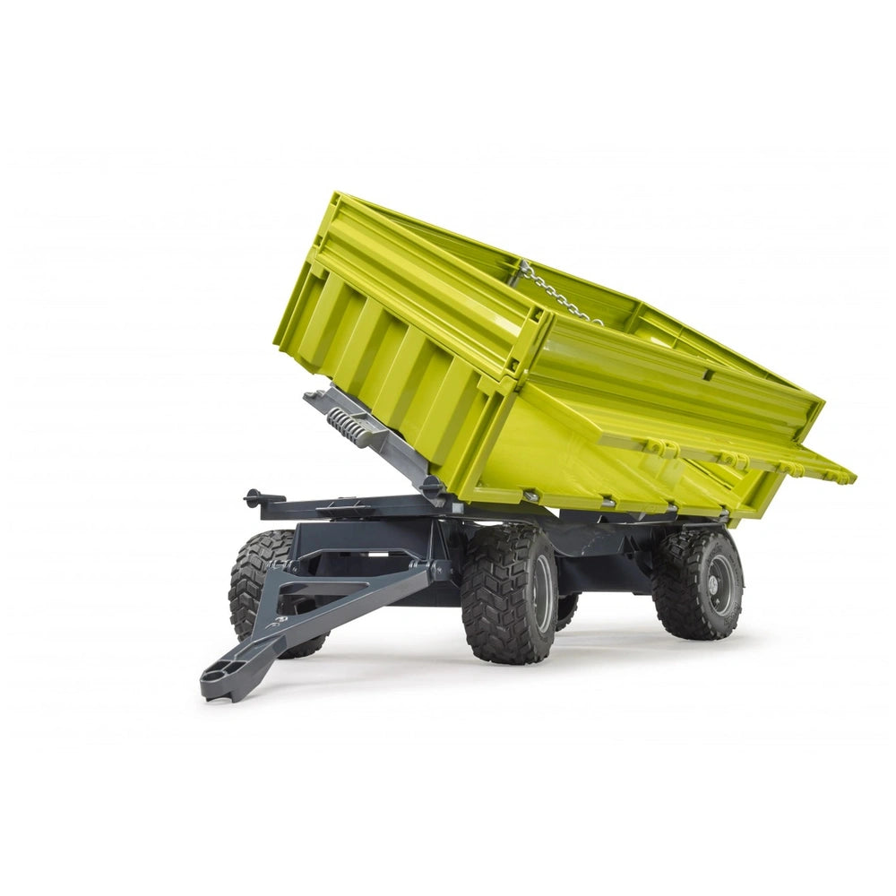 Bright green toy dumper with removable top, angled open, showing tires and steering axle on a white background.