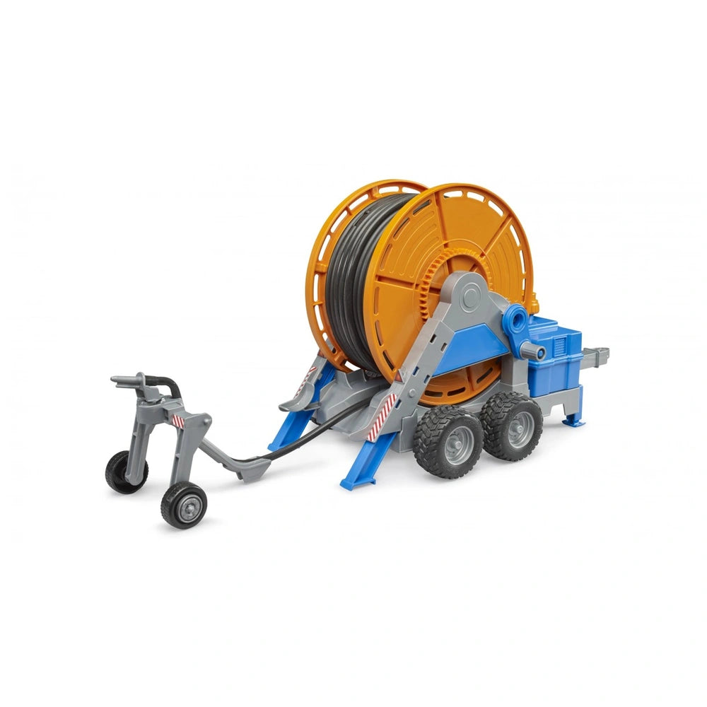 Bruder Irrigation Trailer toy with orange hose reel, gray frame, and blue components on wheels.