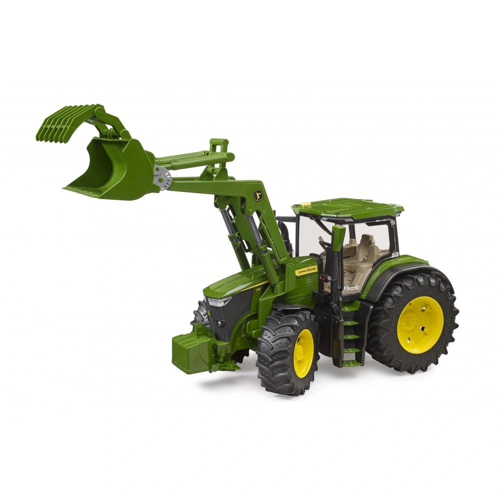 Green John Deere 7R 350 toy tractor with yellow wheels and front loader elevated, on a white background.