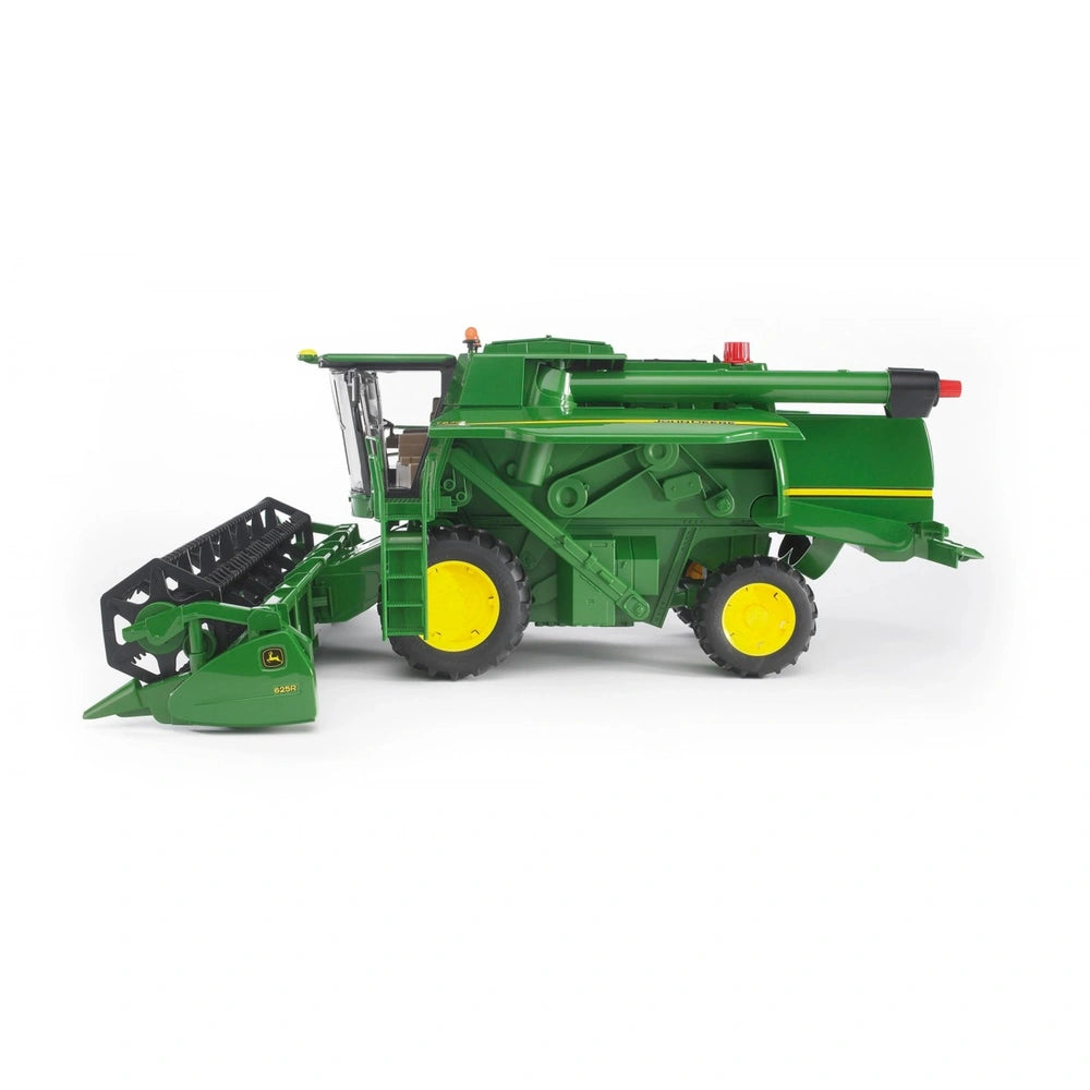 Green Bruder John Deere Combine Harvester T670I toy on white background, featuring yellow wheels and detailed farm machinery.