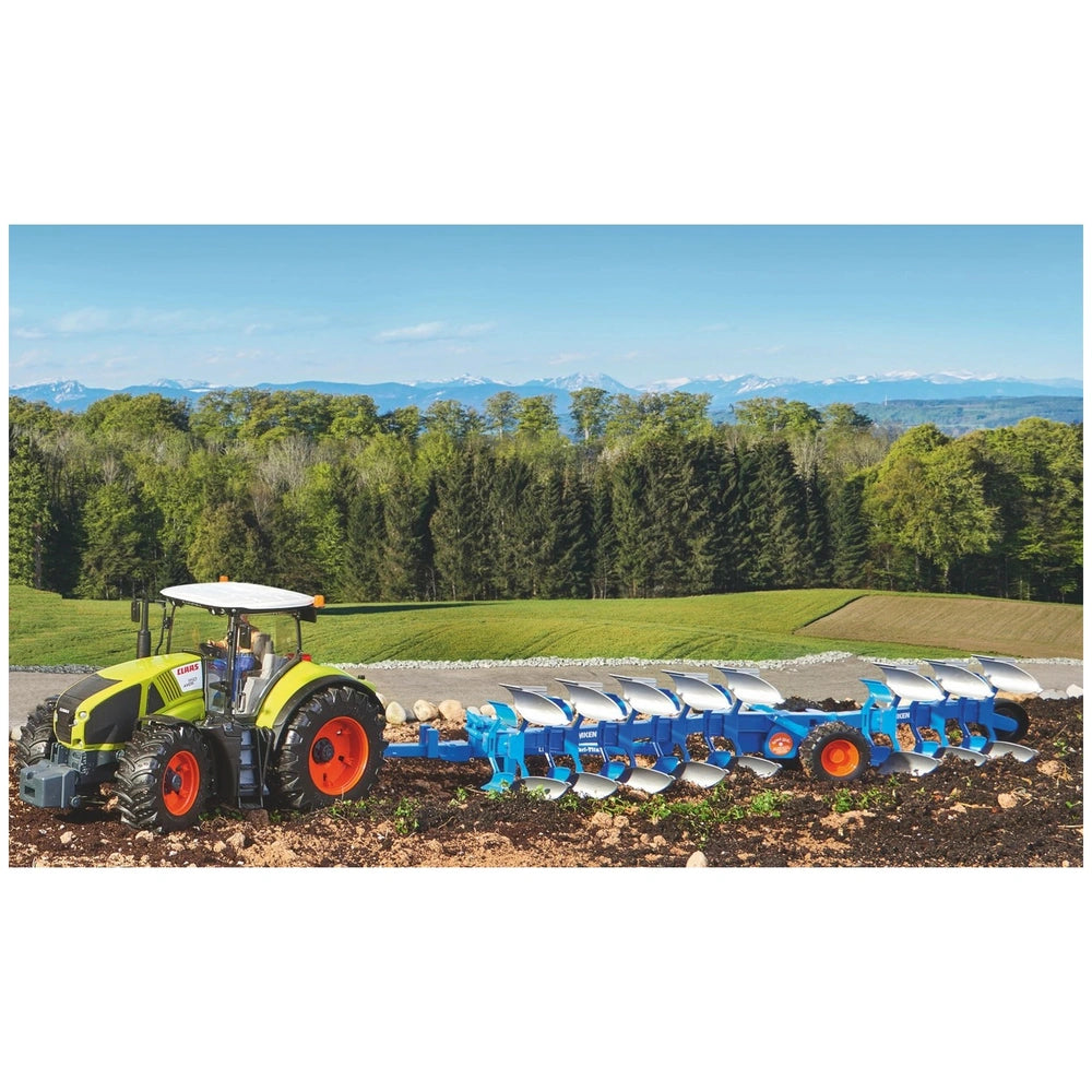 Bruder LEMKEN plough attached to a green tractor on a vibrant field with a forest and mountains in the background.