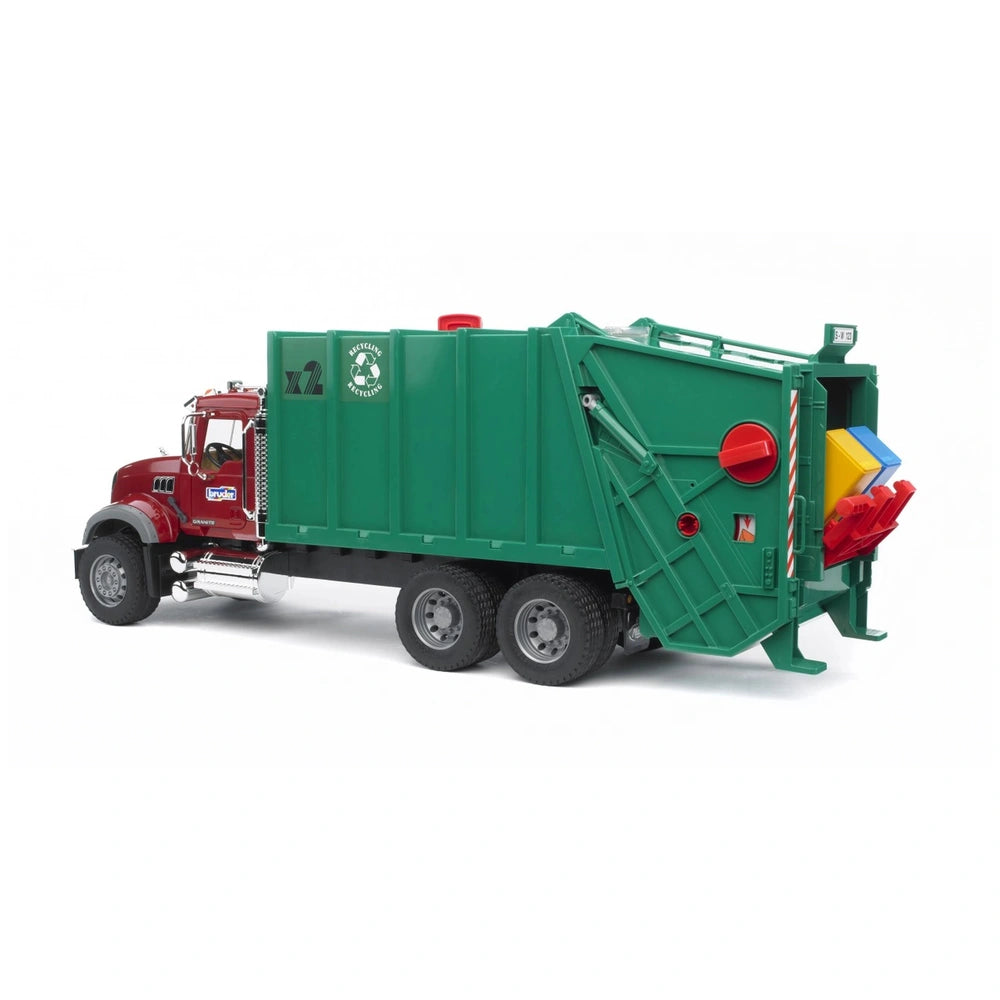 Red and green Bruder Mack Granite garbage truck with realistic features and tilting trash container.