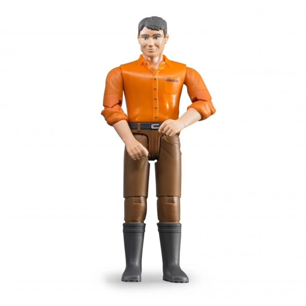 Toy action figure with light skin, orange shirt, brown jeans, and black boots, standing upright with movable limbs.