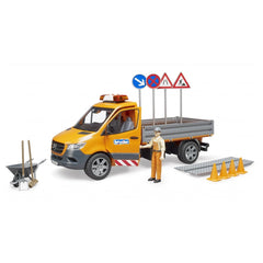 Orange and black Mercedes-Benz Sprinter toy with open doors, traffic signs, cones, and road worker figure in safety gear.