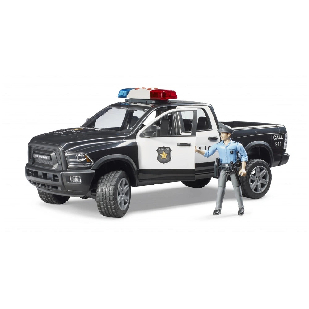 Black and white Bruder RAM 2500 police truck with red and blue lights, includes police officer figure.