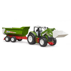 Green and white toy tractor with front loader and rear tipper, featuring large black tires and a red trailer attachment.