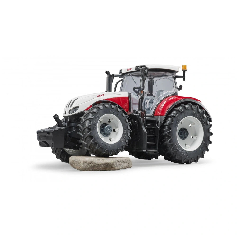 Bruder Steyr 6300 Terrus CVT toy tractor with detailed cabin and large tires on a white background.