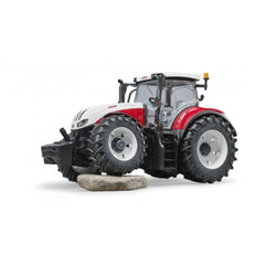 Bruder Steyr 6300 Terrus CVT toy tractor with detailed cabin and large tires on a white background.