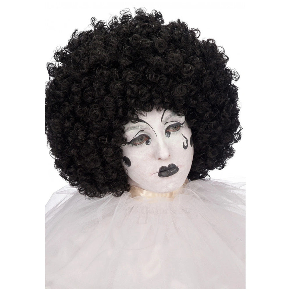 Black curly hair wig with afro style, dramatic white face paint, and dark lipstick on soft white fabric background.