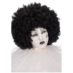 Black curly hair wig with afro style, dramatic white face paint, and dark lipstick on soft white fabric background.