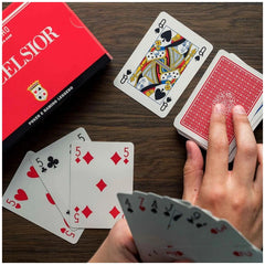 Dal Negro Excelsior Rummy Cards in blue-red deck, featuring glossy playing cards and a textured red box on a wooden surface.