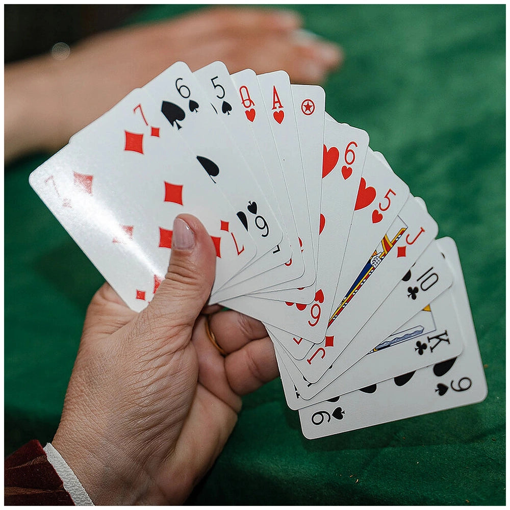 Dal Negro Premium Burraco Cards in red and green, featuring 13 white cards with black numbers and symbols on a textured green
