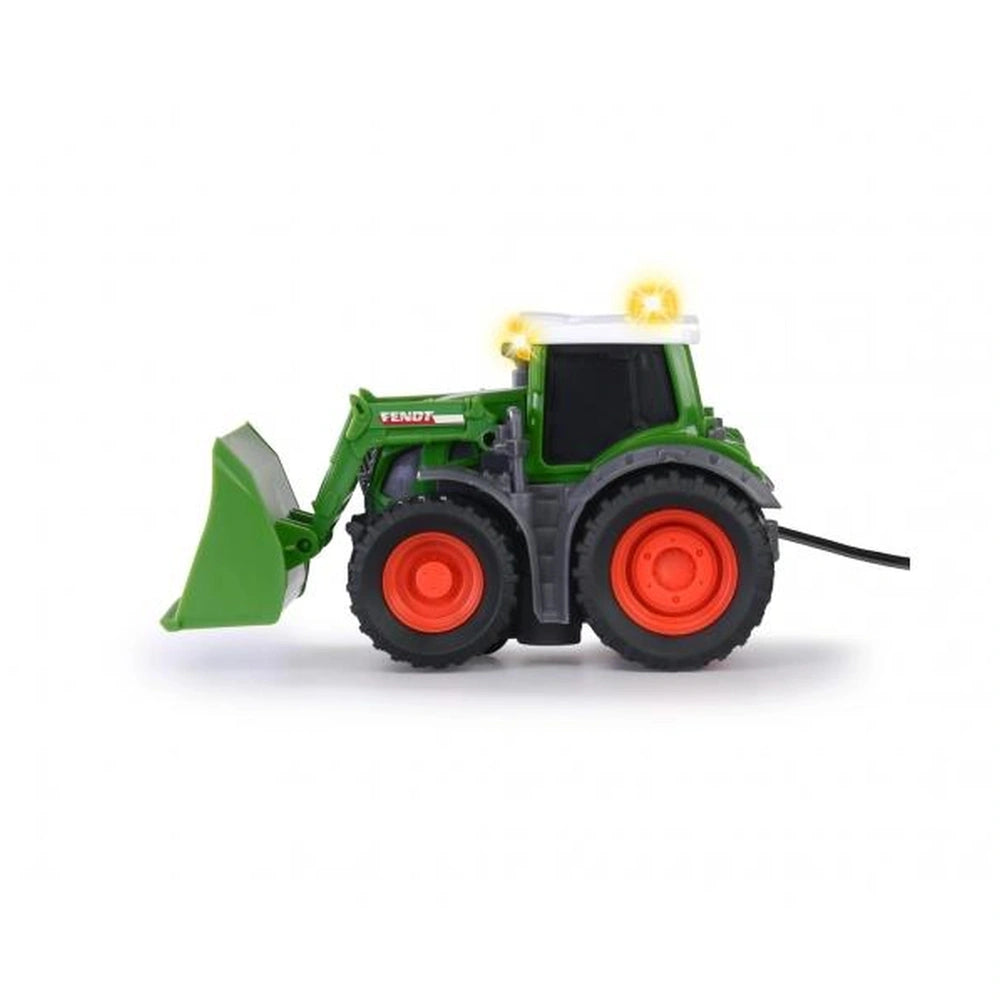 Fendt remote-controlled tractor in green plastic with orange wheels, yellow light, and shovel attachment, displaying "VENDT" 