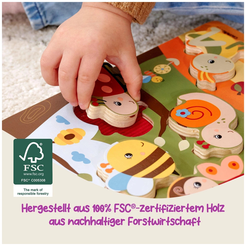 Eichhorn Bee-Happy Sensory Puzzle features colorful wooden animal shapes, with a child's hand holding a piece on a carpeted f