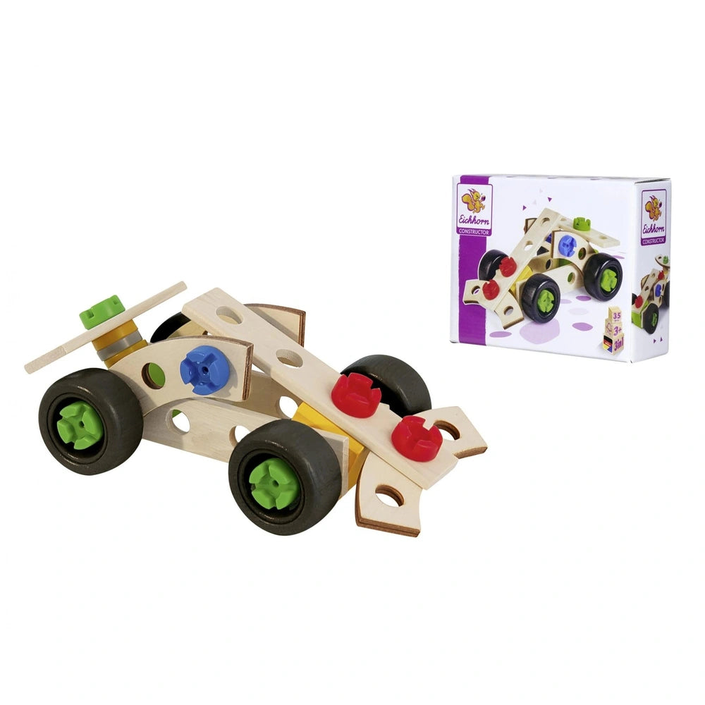 Wooden toy car with black wheels featuring green centers and a red steering wheel with a blue center, centered on a white sur