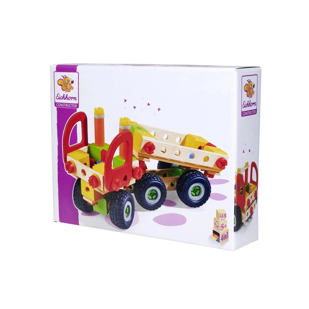 Toy construction set featuring a colorful plastic truck with a flatbed, visible through clear packaging with purple accents.