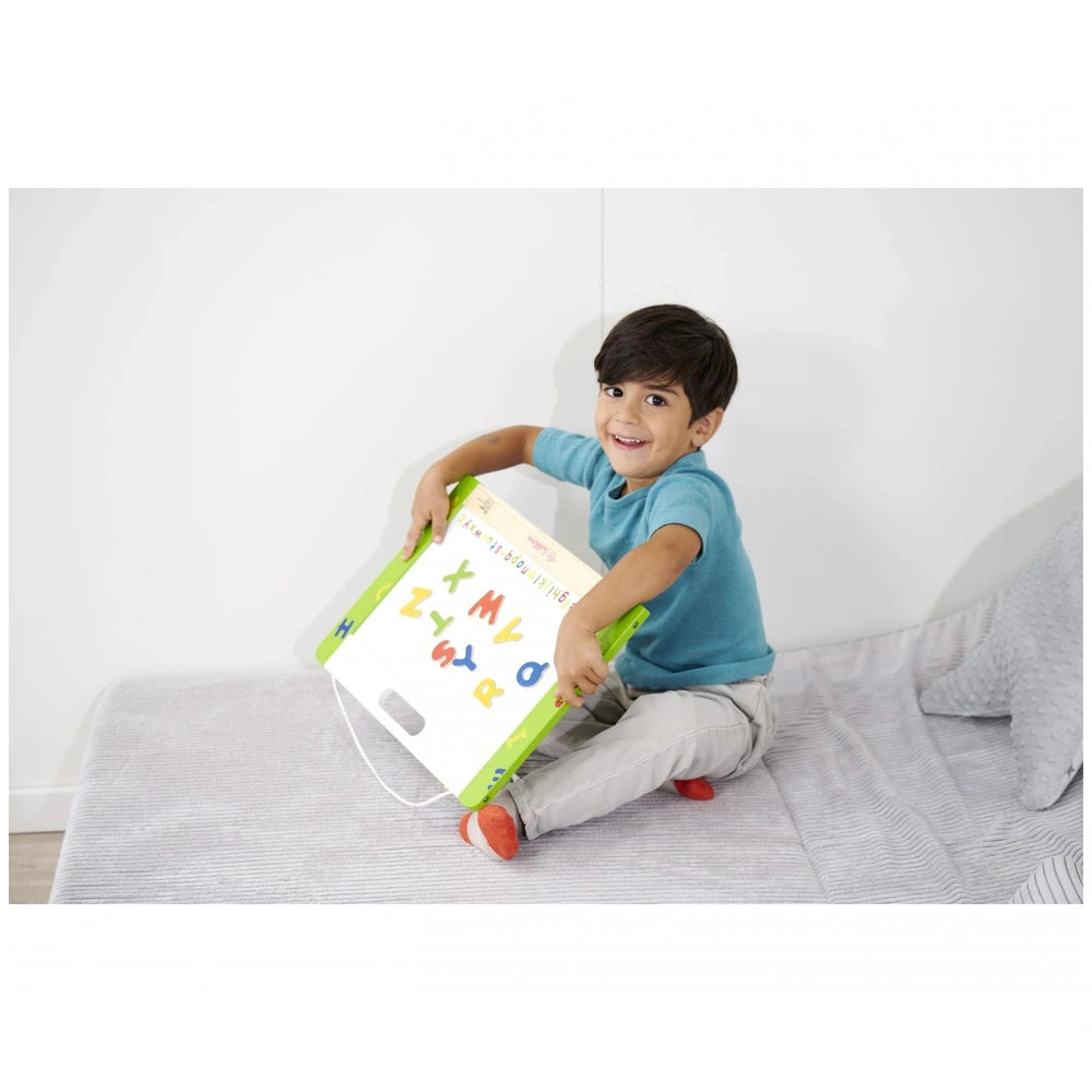 Eichhorn educational toy features a child happily using a magnetic letter board, promoting learning through play.